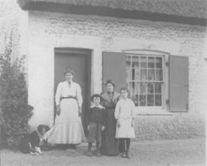 Family outside Stone Cottage